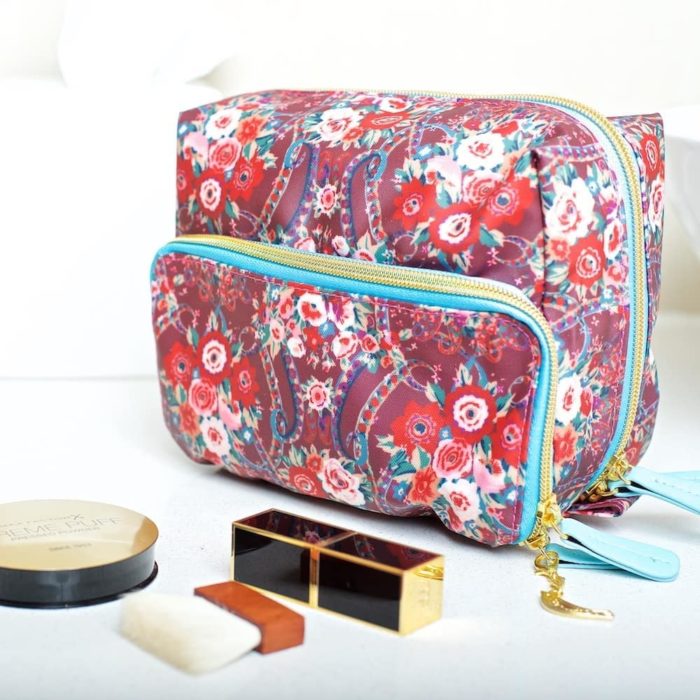 Collier Campbell floral red and purple cosmetic bag styled shot