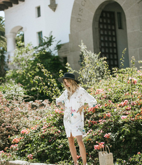 Plum Pretty Sugar model with floral robe and black hat