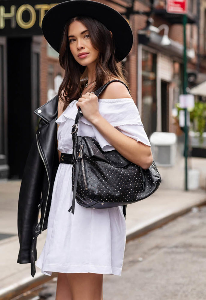 Aimee Kestenburg model with studded black bag and hat