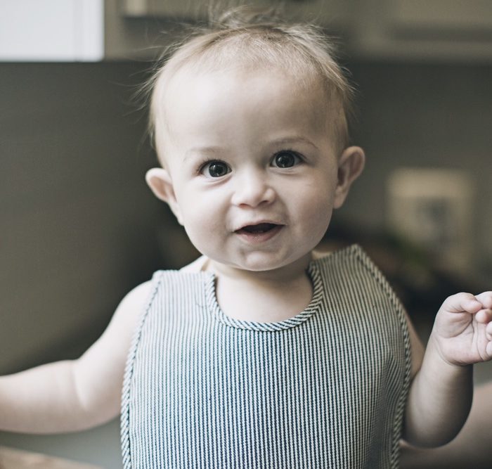 Heirloomed baby with bib