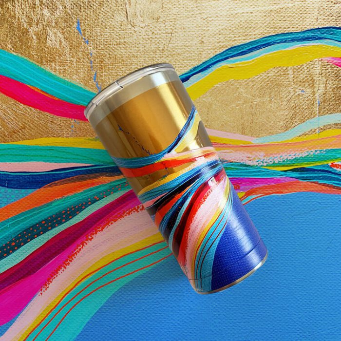 Cup with swirl design on metallic gold background
