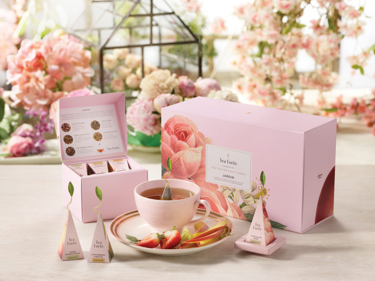 Pink tea gift boxes with botanical artwork