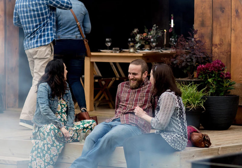 Millennials gather outside a farm-to-table restaurant