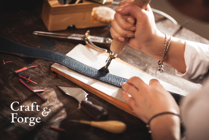 Person working leather with special tools