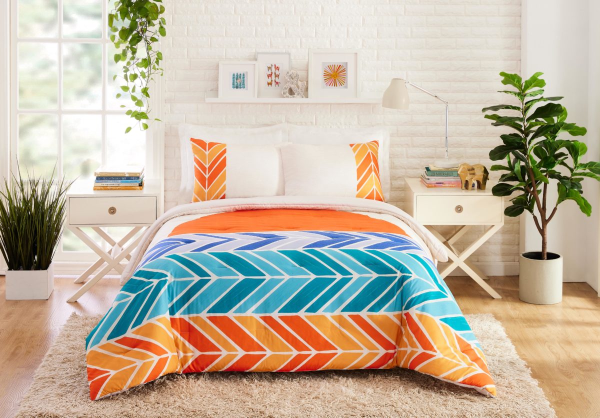 Brightly colored orange and blue chevron bedding set by CatCoq