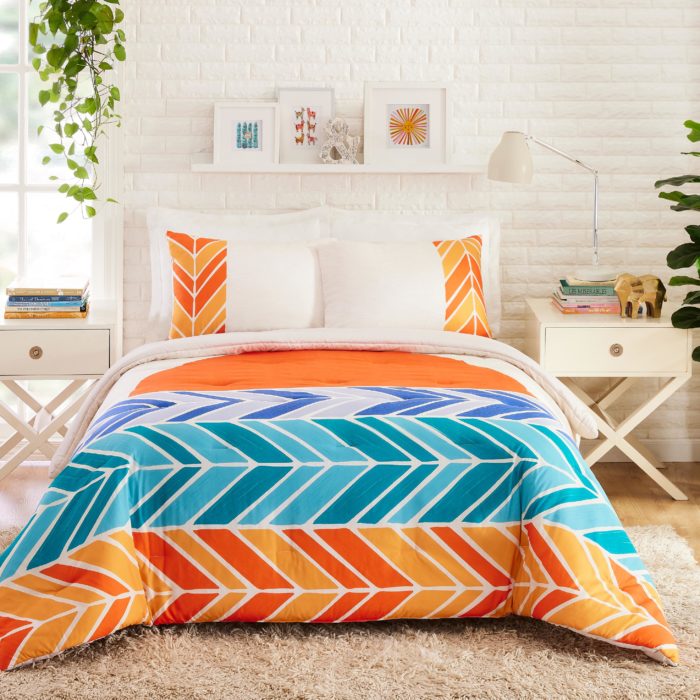 Brightly colored orange and blue chevron bedding set by CatCoq